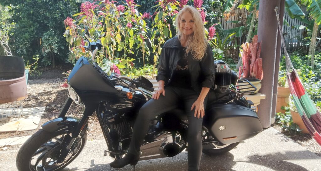 Harley Davidson motorbike and lady rider