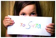 to Santa letter with young girl